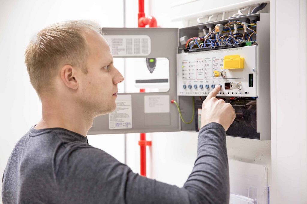 electrician checking panel