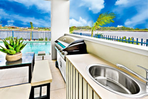 Gas powered outdoor kitchen from Reliable Power Systems by pool.